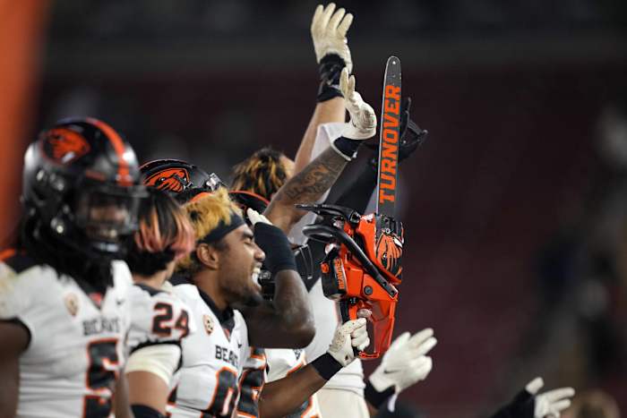 Oct 8, 2022; Stanford, California, USA; Oregon State Beavers players operate a chainsaw after forcing a turnover during the fourth quarter against the Stanford Cardinal at Stanford Stadium. Mandatory Credit: Darren Yamashita-USA TODAY Sports